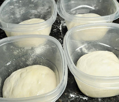 dough balls stored in containers